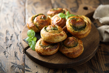 Homemade pastry rolls with pesto sauce