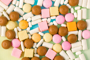 Sweet colorful confectionery, candy on the color background