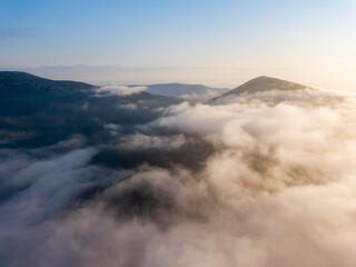 Obraz premium Morning fog in the Ukrainian Carpathians. Aerial drone view.