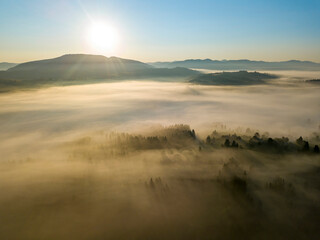 Morning fog in the Ukrainian Carpathians. Aerial drone view.