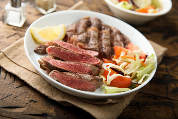 Grilled beef steak with vegetable salad
