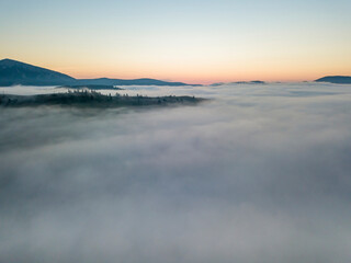 Fototapeta premium Morning fog in the Ukrainian Carpathians. Aerial drone view.