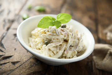Homemade squid salad with capers