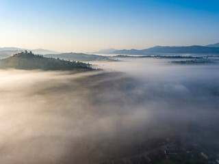 Morning fog in the Ukrainian Carpathians. Aerial drone view.