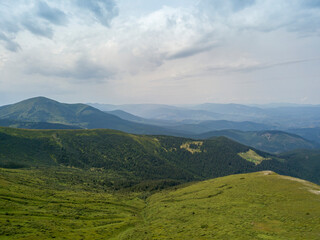Obraz premium High mountains of the Ukrainian Carpathians in cloudy weather. Aerial drone view.