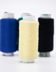 cream color yarn on spool, yarn on tube, cotton, wool, linen thread, isolate on white background