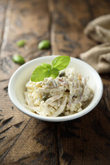 Homemade squid salad with capers