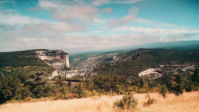 Timelapse of clouds moving over mountain landscape, Gorges de la Nesque, Vaucluse in Provence, southern France. View from viewpoint Belvedere de Saint Hubert.