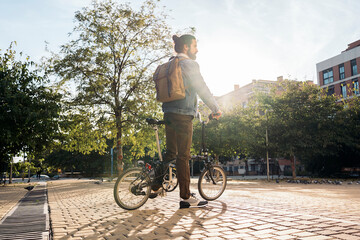 Young Man With Bike in the Street