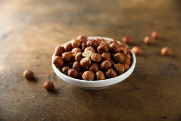 Organic hazelnut in a white bowl