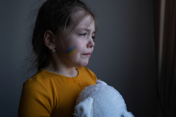 Upset Ukrainian girl kid homeless protesting war conflict. No War. Crisis, peace, stop aggression,...