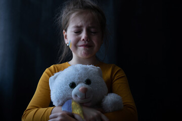 Upset Ukrainian girl kid homeless protesting war conflict. No War. Crisis, peace, stop aggression,...