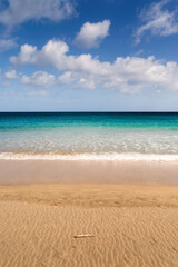 Playa de Sotavento is a stunning beach of golden sand, turquoise waters, and strong winds at Jandia peninsula, Pajara municipality, southeastern Fuerteventura, Canary Islands, Spain