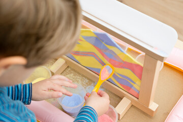Colorful calming sand. Sand art frame for relaxing feeling pre-school or nursery to supply sensory...