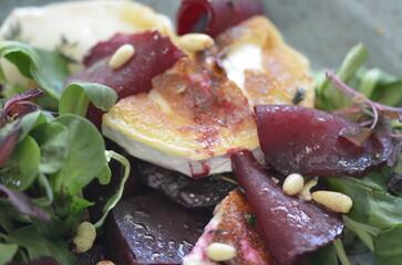 Fototapeta na wymiar beetroot Salad with red marinated beets, cheese and salad