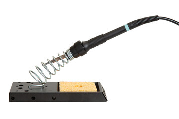 Electric soldering iron on a stand with a cleaning sponge