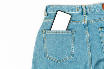 phone in jeans pocket on white background