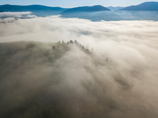Morning fog in the Ukrainian Carpathians. Aerial drone view.