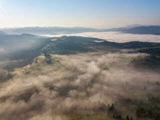 Morning fog in the Ukrainian Carpathians. Aerial drone view.