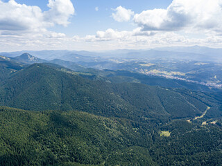 Fototapeta premium High mountains of the Ukrainian Carpathians in sunny weather. Aerial drone view.