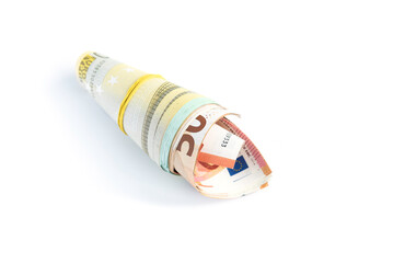 Rolled up euro banknotes on a white background.