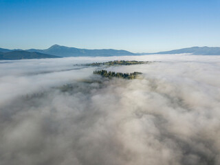 Fototapeta premium Morning fog in the Ukrainian Carpathians. Aerial drone view.