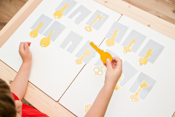 Keys and locks. Find the right key for the right shadow. Montessori style brain exercise game for...