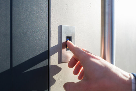 opening front door of house by fingerprint. modern smart digital technologies