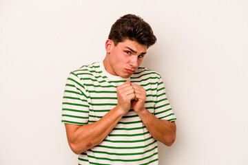 Young caucasian man isolated on white background scared and afraid.