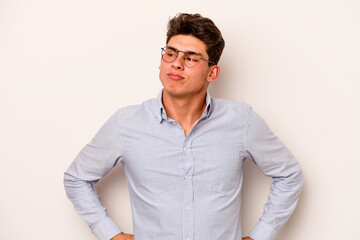 Young caucasian man isolated on white background dreaming of achieving goals and purposes
