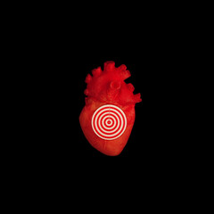 Abstract organic organ human heart with real target symbol. Love emotional wounded heart concept. Seducing snipe victim idea