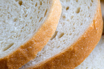 Toast wheat bread sliced with an appetizing crust on the table.