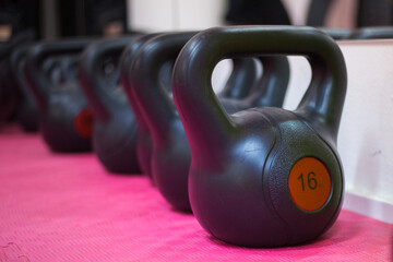 Naklejka na ściany i meble dumbbells and kettlebell gym equipment work with weights