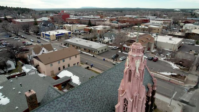 aerial over church with cross atop steeple in flagstaff arizona