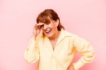 Middle age caucasian woman isolated on pink background joyful laughing a lot. Happiness concept.