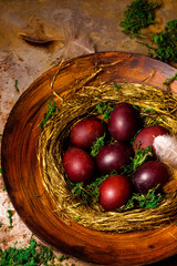 Fototapeta na wymiar Beautiful red Easter eggs in a nest
