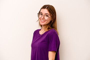 Young caucasian woman isolated on white background confident keeping hands on hips.