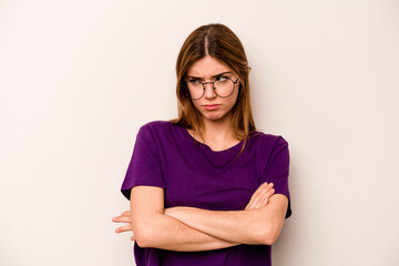 Fototapeta premium Young caucasian woman isolated on white background tired of a repetitive task.