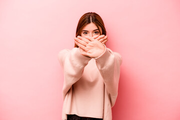 Young caucasian woman isolated on pink background doing a denial gesture