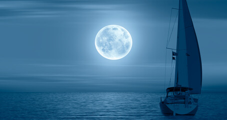 Lone yacht with Super Full Moon 