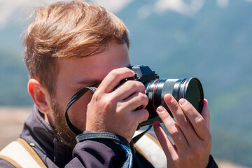 Photographer taking pictures in nature. Course Lesson class learning photography.	
