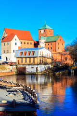 Fototapeta na wymiar Castle of the Pomeranian Dukes or Darlowo castle on a bank of the Wieprza river in Darlowo, Poland