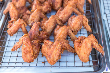 crispy fried chicken on street food market in Thailand. Delicious homemade crispy fried chicken. Crunchy Fried Chicken Ready To Eat