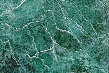 background surface texture in various shades of green covered with irregular lines