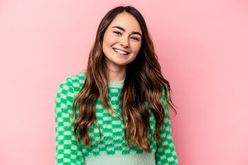 Fototapeta premium Young caucasian woman isolated on pink background dancing and having fun.