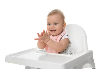 Cute little baby wearing bib in highchair on white background