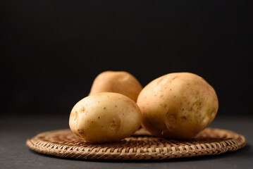 Organic potato from Thai farmer  local market on black background