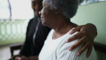 Obraz premium Grandchild taking care of grandmother giving elderly support