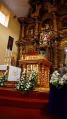 old church with objects bathed in gold, church of Peru
