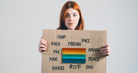 ukrainian girl holding an anti-war placard in her hand